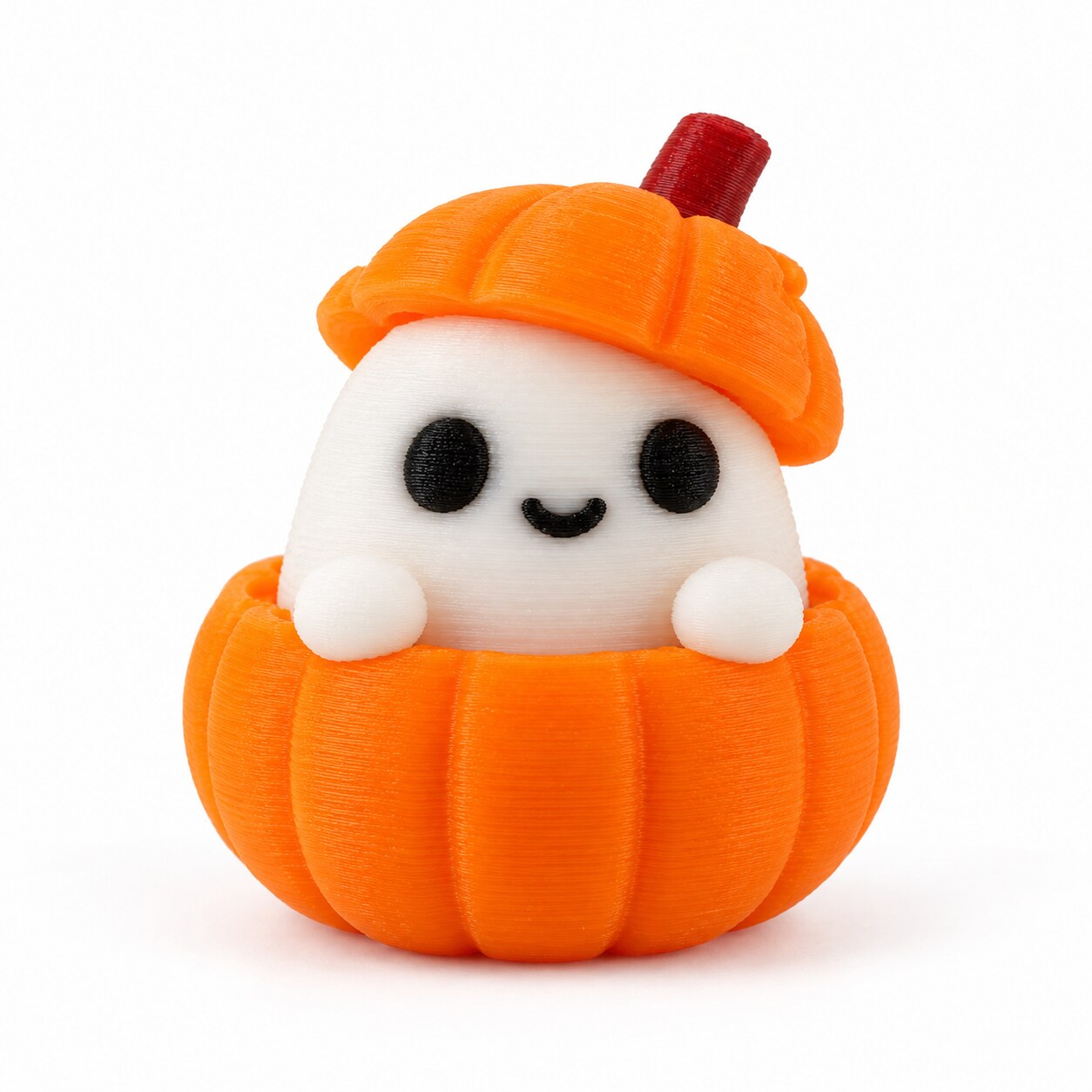 Our real 3D-printed white ghost peeking out of an orange pumpkin